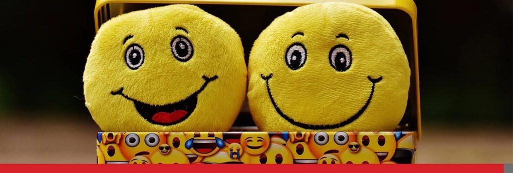 Happy emoji plushies.